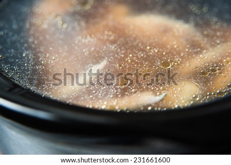 Chicken Legs Bone Broth Being Cooked in Slow Cooker