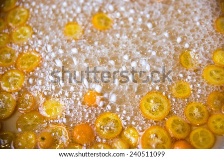Process of Making Candies Kumquat Oranges in Sugar Water on Stove