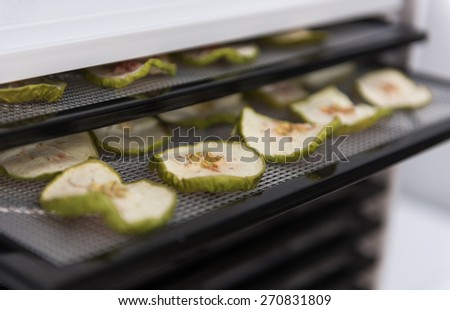 Dehydrating Sliced Granny Smith Apples in Excalibur. Tray Out to Check Readiness.