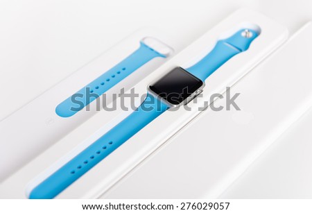SEATTLE, USA - APR 30, 2015: New wearable computer Apple Watch smart watch fresh out of the box shown with second smaller band.