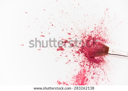 Makeup Brushes on White Background with Colorful Pigment Powder