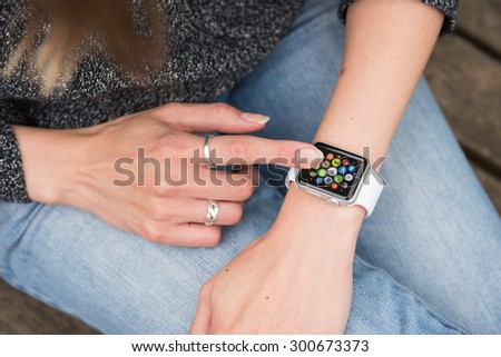 SEATTLE, USA - July 28, 2015: Woman Using Apple Watch. Multiple Apps View.