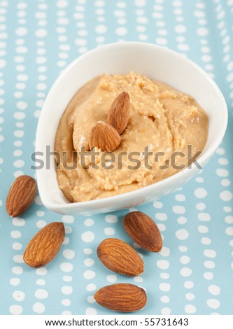Almond Butter in White Bowl with Almonds Around
