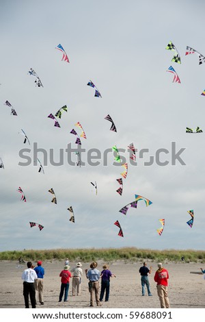 LONG BEACH,WA - AUGUST 21: Participants of kite flying competition on August 21, 2010 in Long Beach, WA, USA. International Kite Festival brings together kite flyers from all over the world