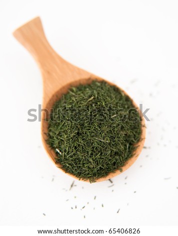 Bamboo Spoon with Dried Dill on White Background