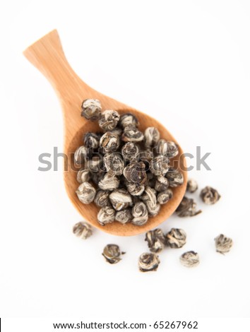 Bamboo Spoon Filled with Serving Size of White Pearl Tea Leaves