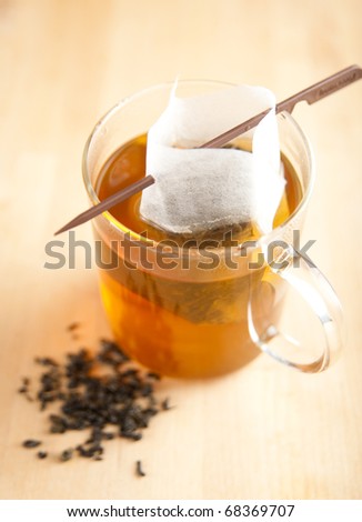 Clear Cup of Green Tea with Paper  Filter