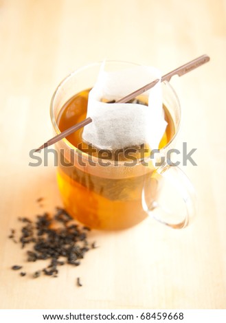 Clear Cup of Green Tea with Paper  Filter