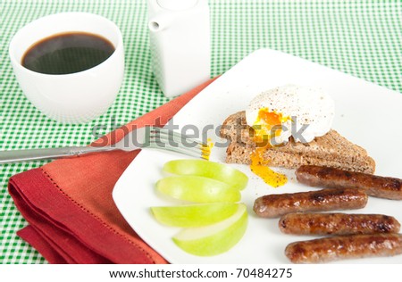 Simple Traditional American Breakfast with Coffee, Sausages, Poached Egg and Whole Grain Toast