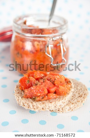 Freshly Made Bruschetta in Glass Jar with Toasted Whole Grain Bread