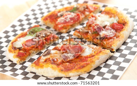 Fresh Homemade Pizza with Mushrooms, Mozzarella Cheese, and Prosciutto