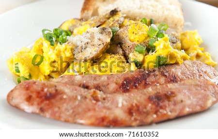 Traditional American Breakfast with Eggs, Sausage and Toast
