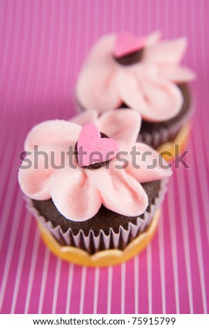 Cute Chocolate Cupcakes with Tiny Heart Candy on Top