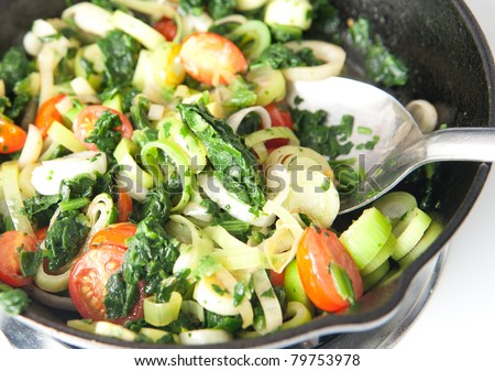 Cast Iron Skillet with Lots of Different Vegetables Sauteed in Olive Oil