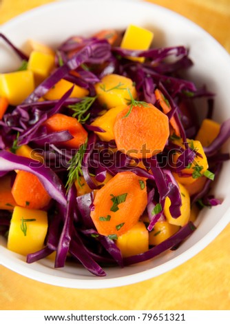 Bowl of Red Cabbage Coleslaw with Carrots and Mango