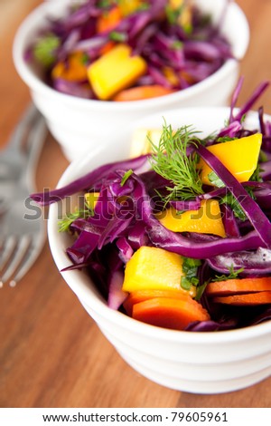 Bowls of Red Cabbage Coleslaw with Carrots and Mango
