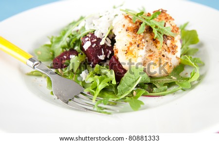 White Fish Fried in Coconut Flakes and Served with Fresh Arugula and Beets