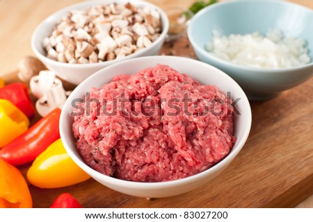 Raw Ground Beef and Other Ingredients to Cook Dinner