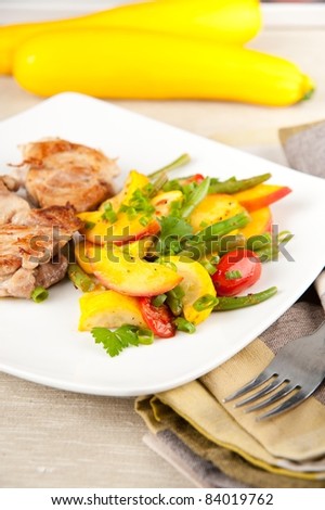 Sauteed Chicken Thighs Served with Cooked Yellow Zucchini, Peaches, Green Beans and Tomatoes