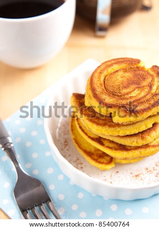 Gluten Free Coconut Flour Pancakes Served for Breakfast with Black Coffee and Maple Syrup