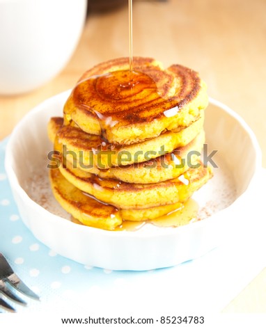 Gluten Free Coconut Flour Pancakes Served for Breakfast with Black Coffee and Maple Syrup