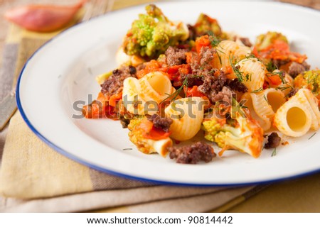 Dinner with Pasta, Ground Beef and Sauteed Vegetables Served with Lemonade