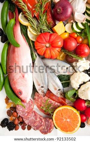 Healthy Food Assortment with Fish, Eggs, Vegetables, Fruit and Cured Meats for Healthy Diet full of Antioxidants and Vitamins