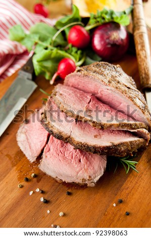 Medium Rare Cooked Beef Roast with Vegetables and Spices