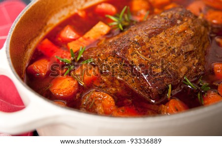 Round Beef Roast Prepared with Carrots and Yams in French Oven