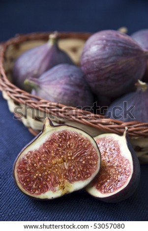 Fresh figs on a dark background.