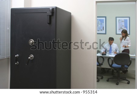 Safety box in an office with an employee and his secretary