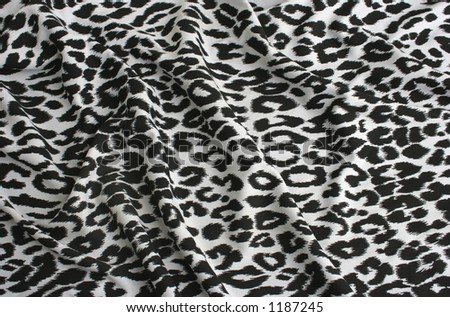 Animal print on fabric. White leopard, tiger.  Look at my gallery for more backgrounds and textures