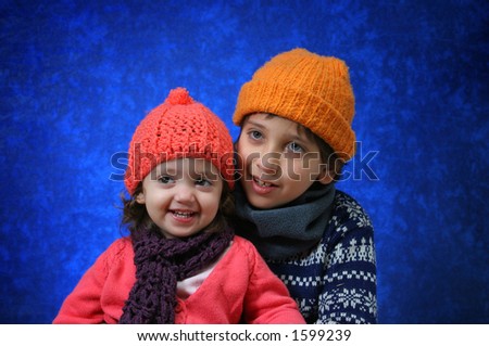Brother and sister having fun in winter outfit.