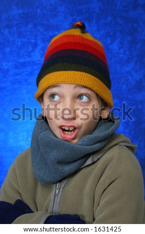 Boy doing fun expression  in winter outfit. Look at my gallery for more winter images