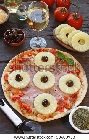 Pineapple pizza with olives and ingredients