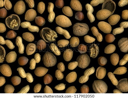 Mixed nuts isolated on black background
