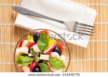 Top view of Fresh Greece Salad Served on Bamboo background