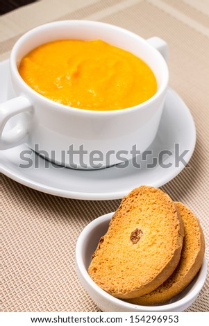 Sweet Pumpkin porridge in white bowl at the table