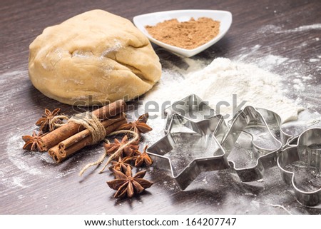 Dough of gingerbread with spices and cookie cutters