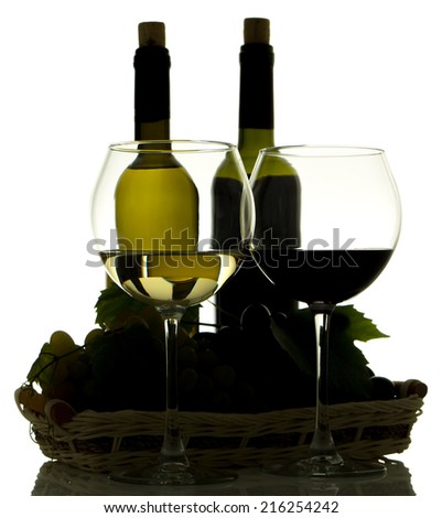 Silhouette of varieties wine in bottles and grapes in basket isolated on white background