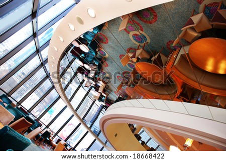 round restaurant with furniture in ceiling mirror reflection upside down