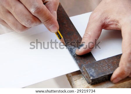 manual worker hands drawing a line  on white plastic track