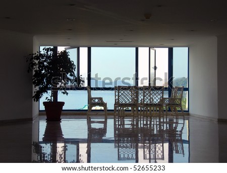 hotel lobby on seaside in Turkey, chairs and table by window