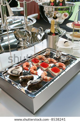luxury sea food snack on chrome board