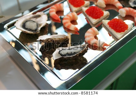luxury sea food snack on chrome board