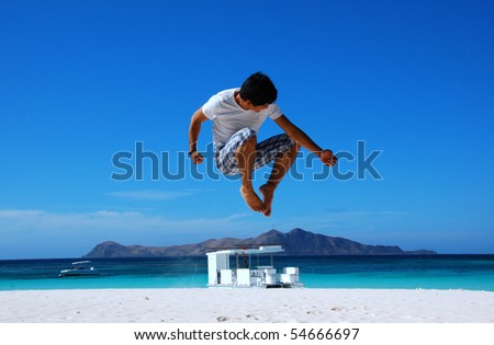 Man jumping in a beach