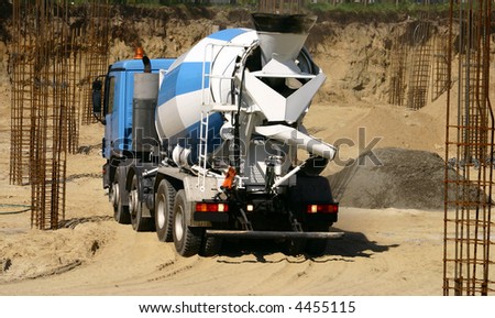 View at concrete-truck backwarding through constructions