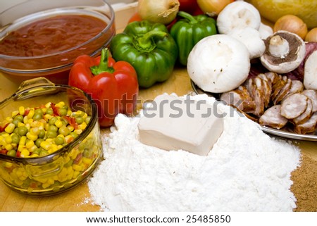 Lot of food ingredients waiting to be pizza