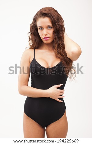 Sexy perfect brunette woman in black body on white isolated background