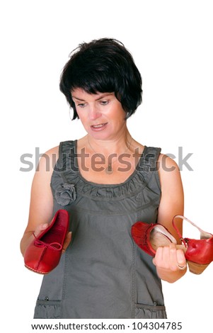 Woman with two different red shoes